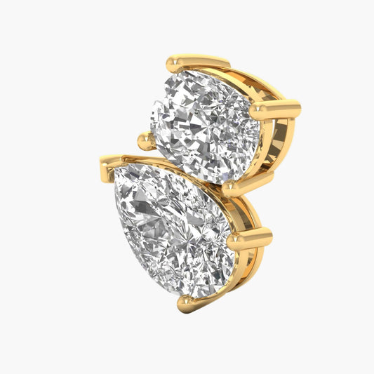 Gold earrings with pear-shaped and round diamonds on a white background