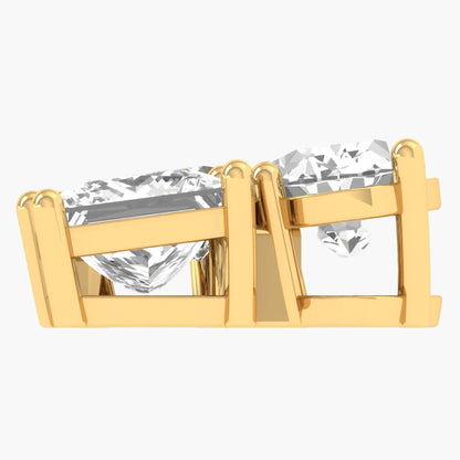 Gold earring with clear gemstones on a white background
