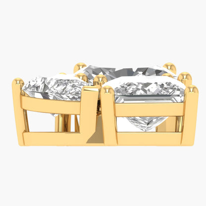Gold earrings with clear gemstones on a white background