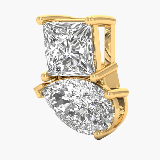 Gold earring with two diamond stones on a white background