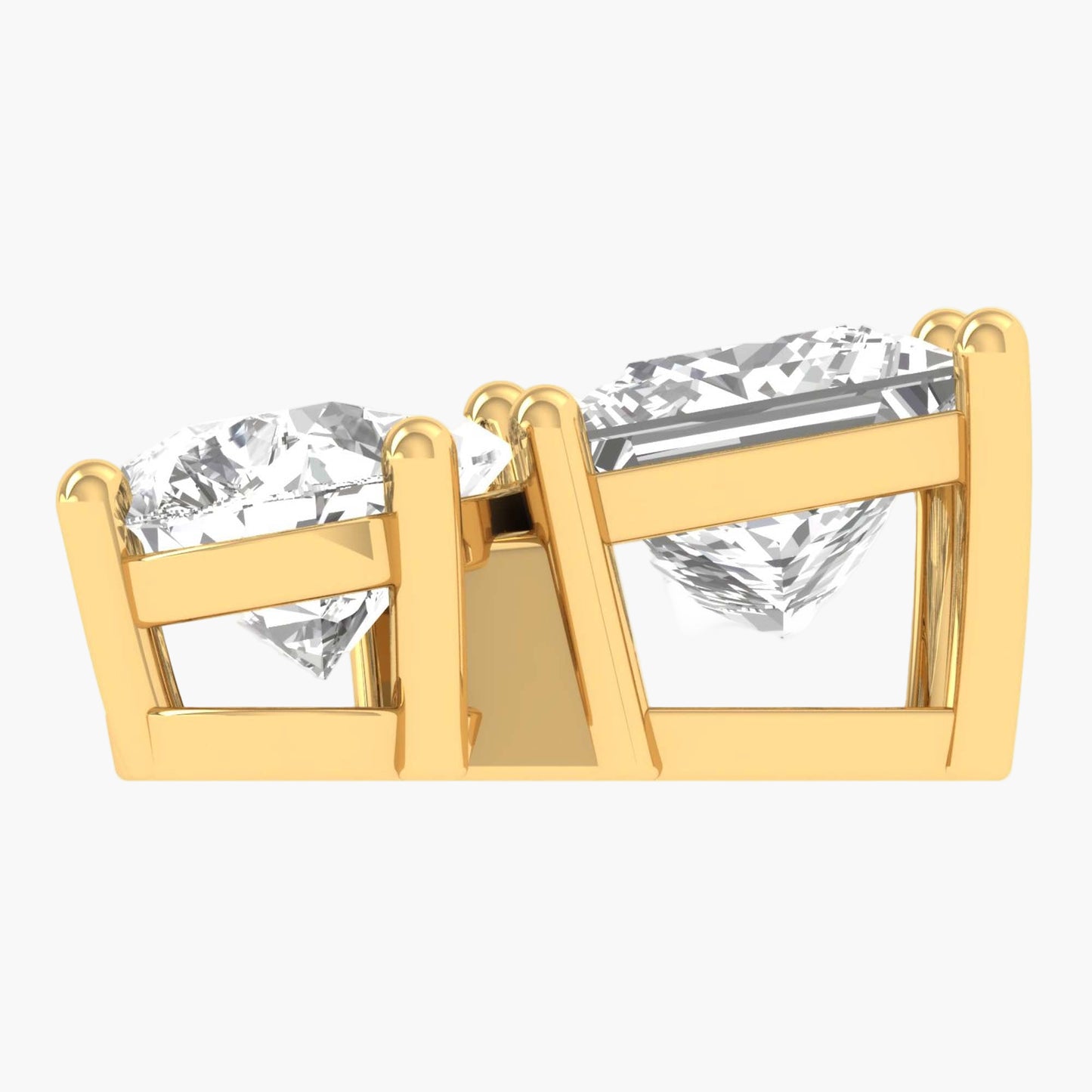 Gold earrings with clear gemstones on a white background