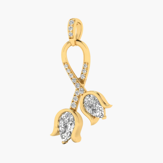 A yellow gold pendant featuring two pear-cut clear gemstones in leaf-shaped settings, connected by an openwork gold design paved with small clear stones, shown on a plain white background.