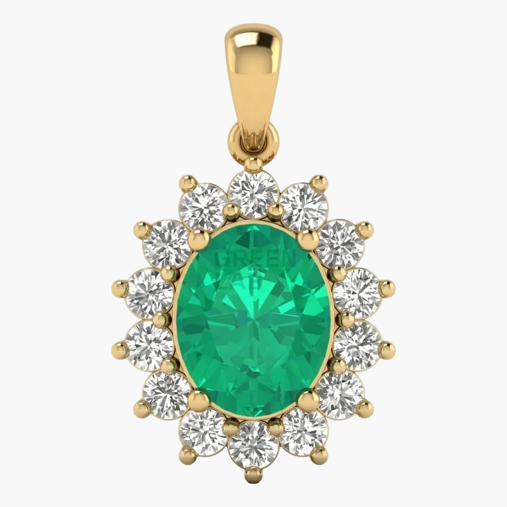 Gold pendant with a green gemstone and clear stones on a white background
