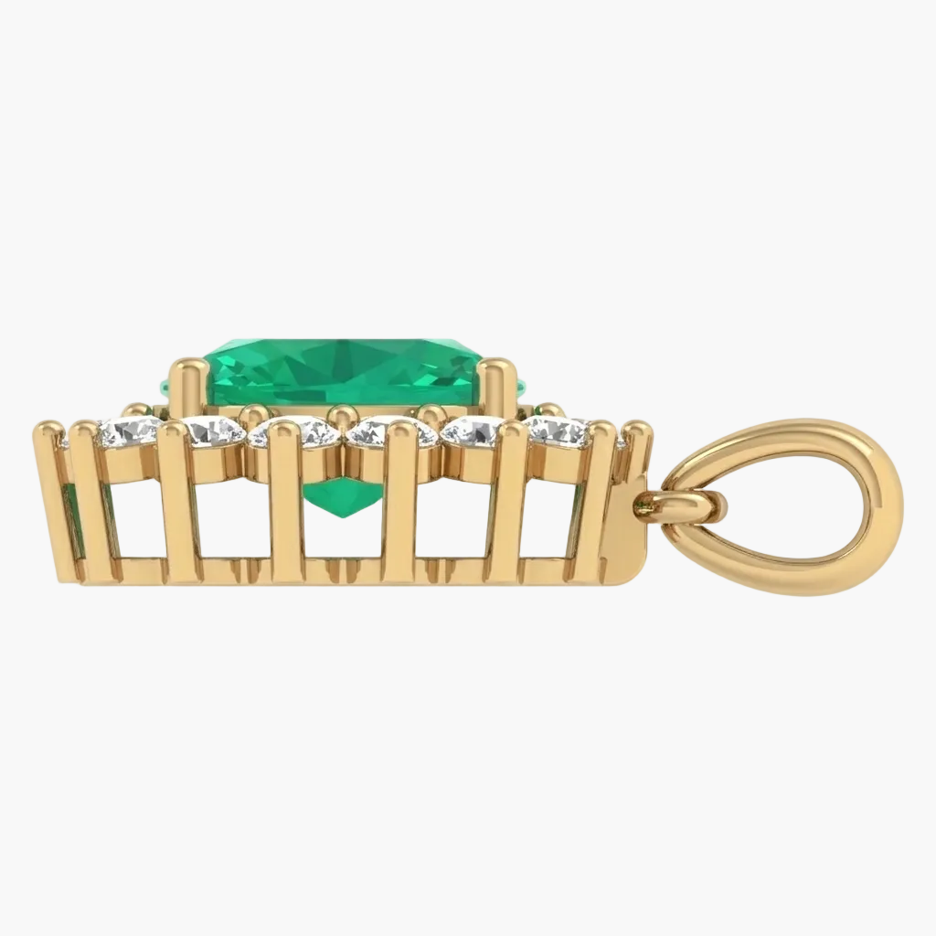 Gold pendant with a green gemstone and clear stones on a white background