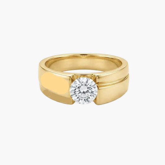 A yellow gold ring with a single round-cut clear gemstone in a prong setting, photographed on a clean white background.