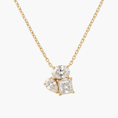 Gold necklace with a diamond pendant on a beige background