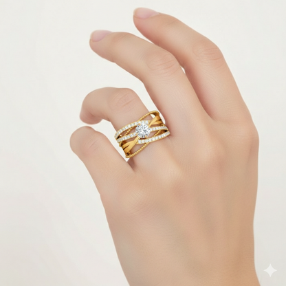 Gold ring with a diamond on a hand against a light background