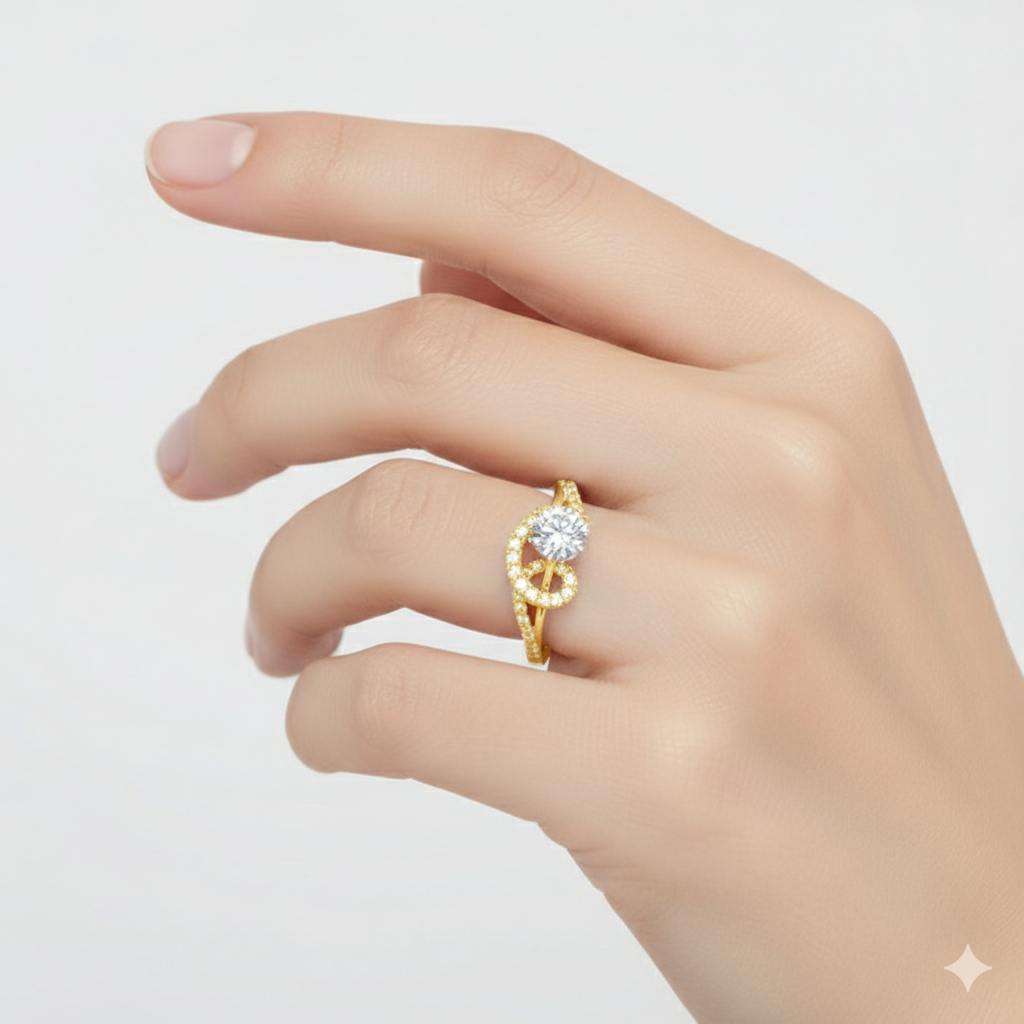 Gold ring with a diamond on a hand against a light gray background
