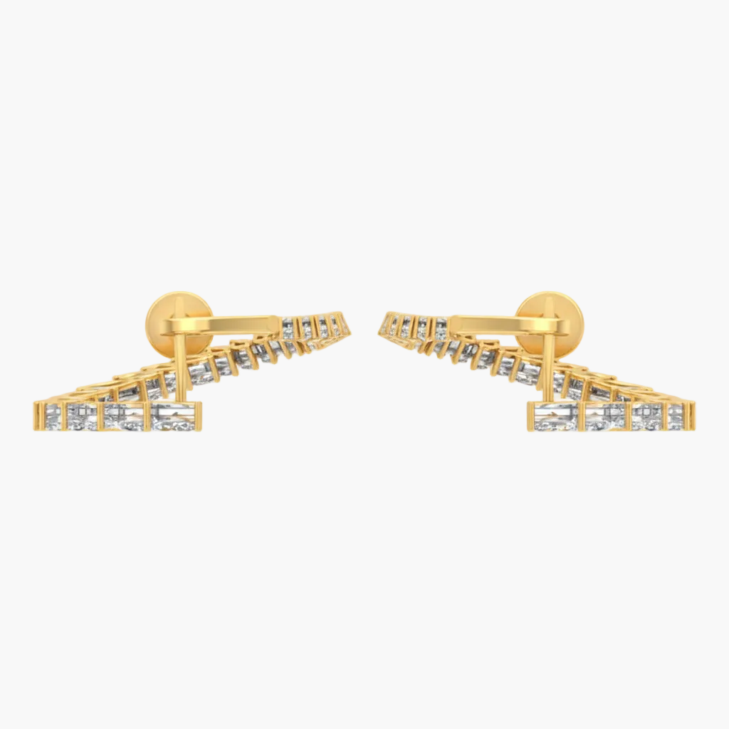 Gold earrings with clear stones on a white background