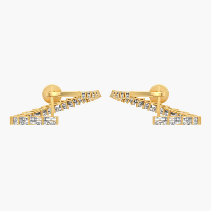 Gold earrings with clear stones on a white background