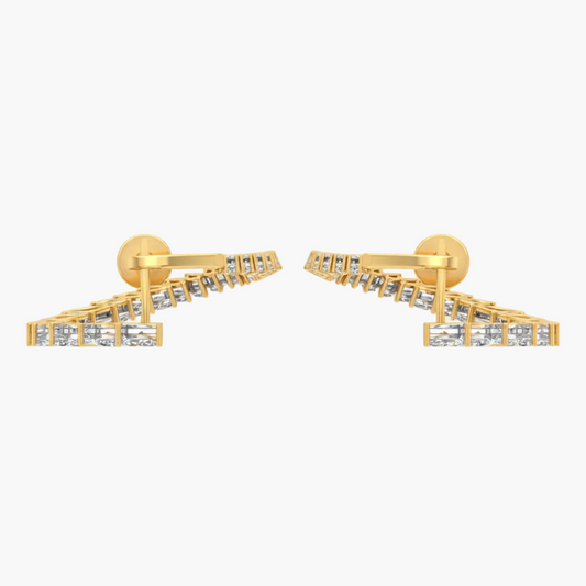 Gold earrings with clear stones on a white background