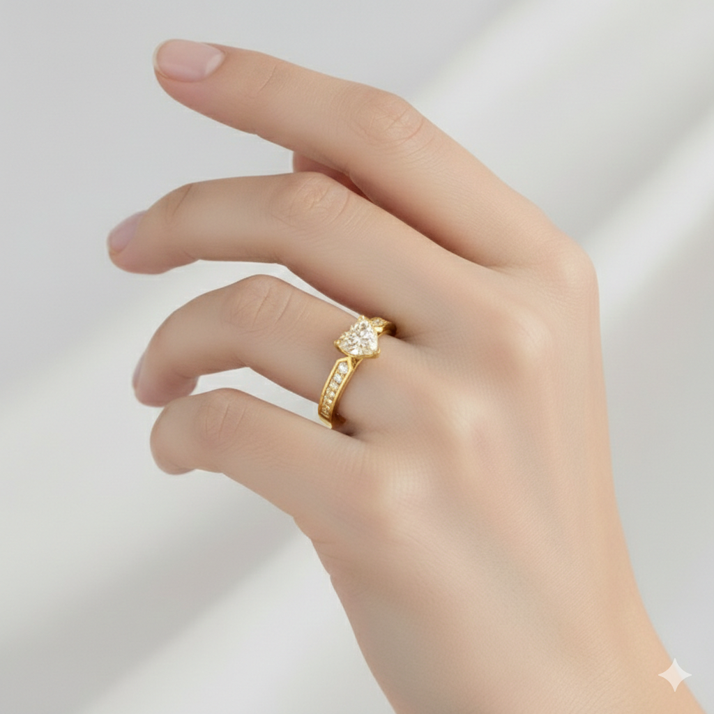 Gold ring with a diamond on a hand against a light background