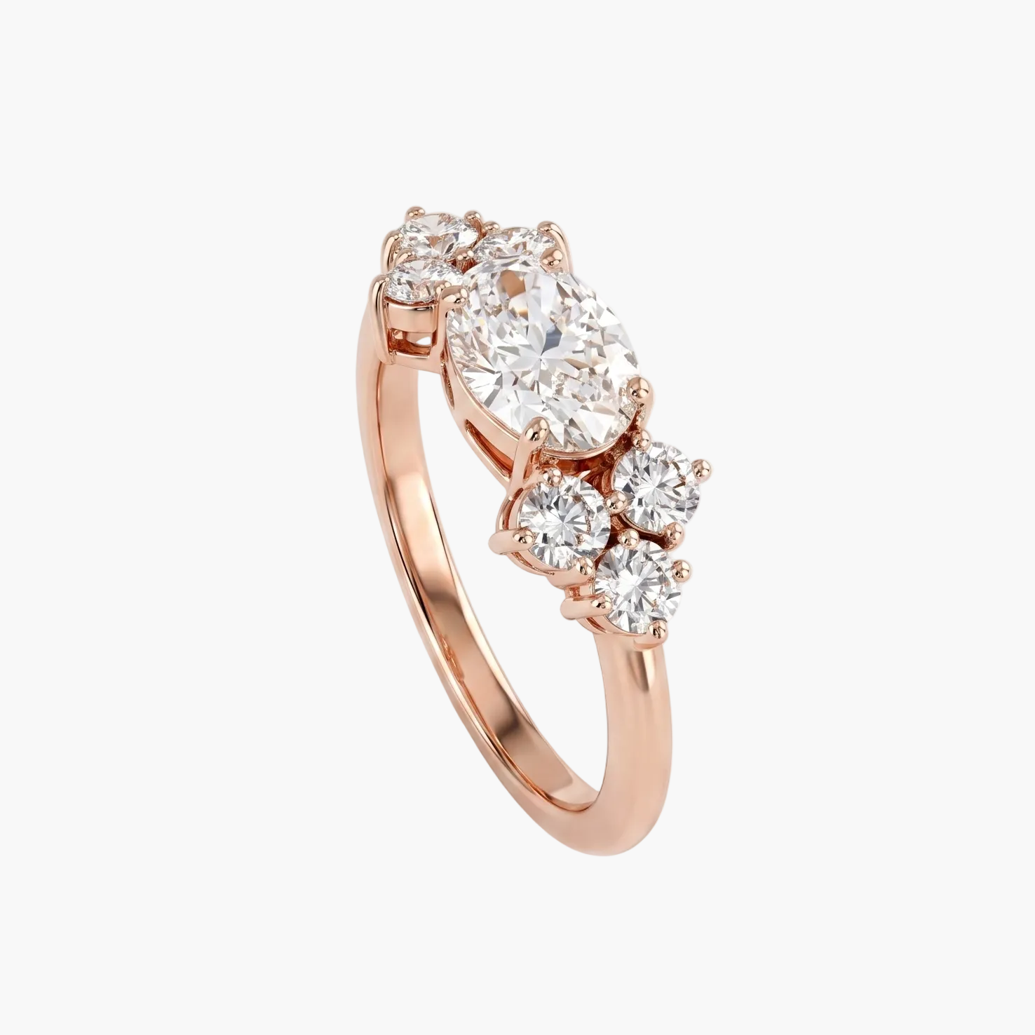 Rose gold ring with three diamonds on a light gray background