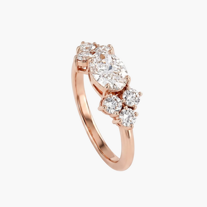 Rose gold ring with three diamonds on a light gray background