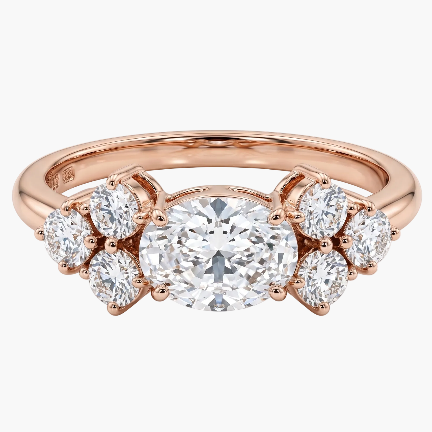 Rose gold ring with a large diamond and smaller diamonds on a white background