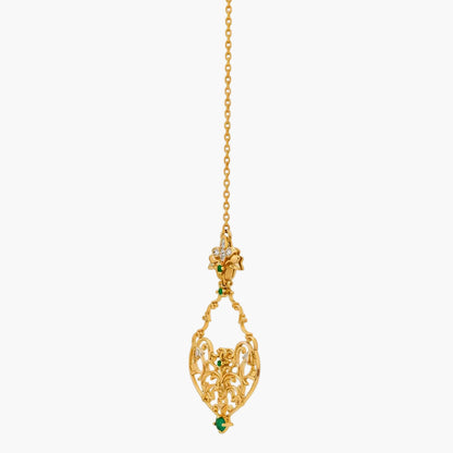 Gold necklace with a decorative pendant on a white background