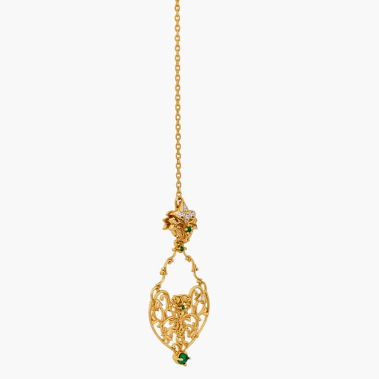 Gold necklace with a decorative pendant on a white background