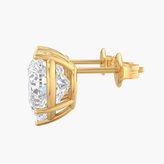 Gold earring with clear gemstone on a white background