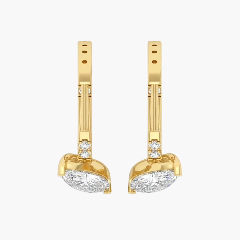 Gold earrings with clear gemstones on a white background