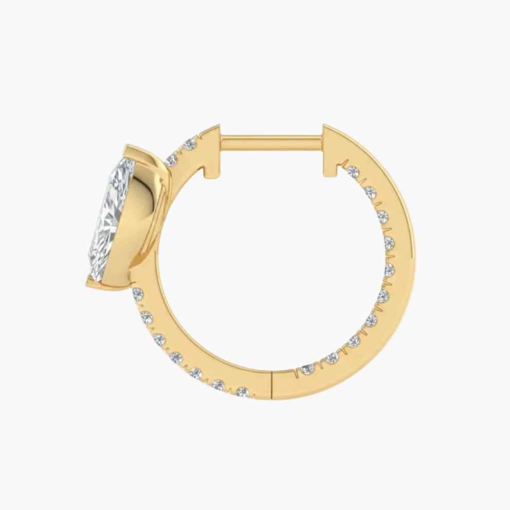Gold hoop earring with clear gemstones on a white background