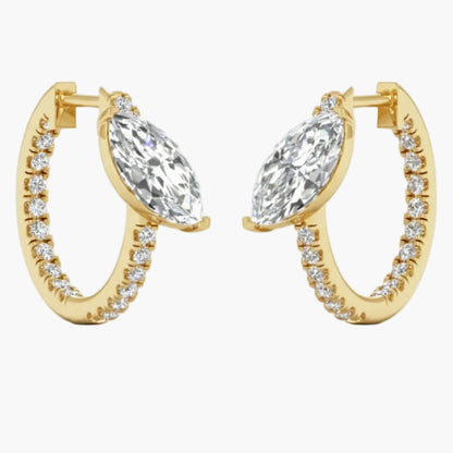 Gold hoop earrings with clear gemstones on a white background
