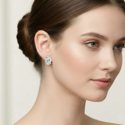 Woman wearing a diamond earring on a plain background