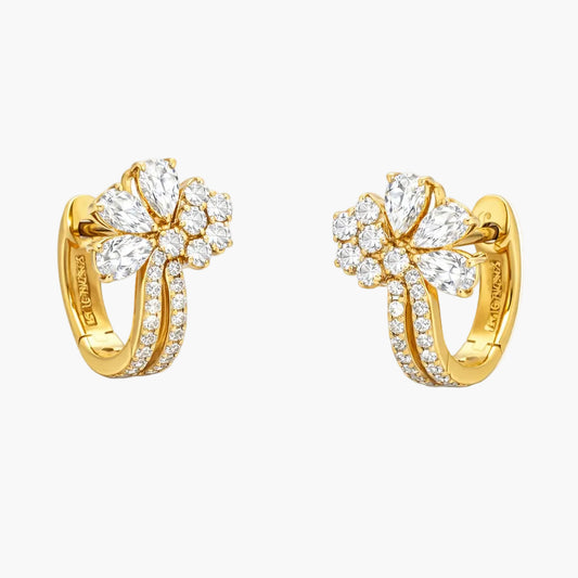 Gold hoop earrings with diamond accents on a white background