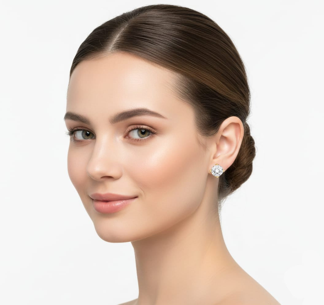 Woman wearing diamond earrings on a white background