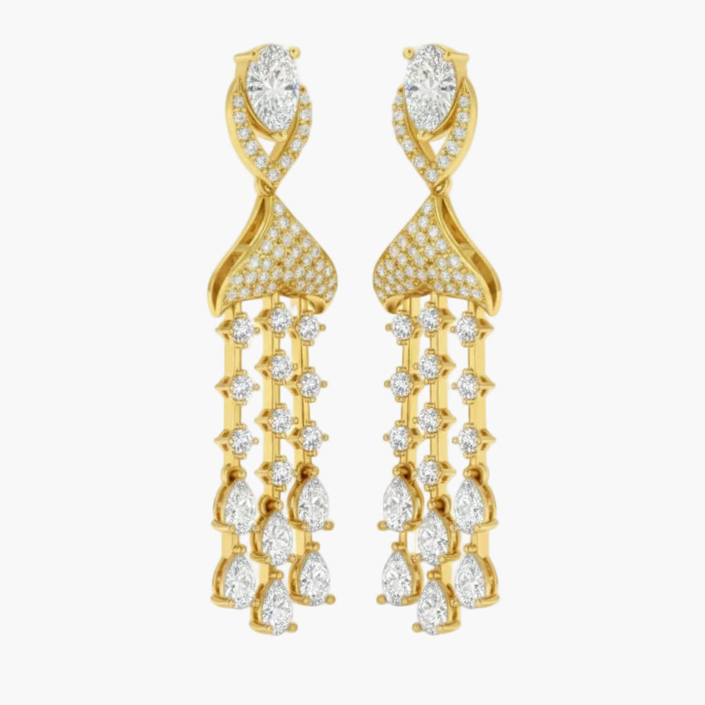 Gold earrings with clear gemstones on a white background