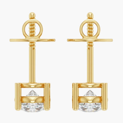Gold earrings with clear gemstones on a white background