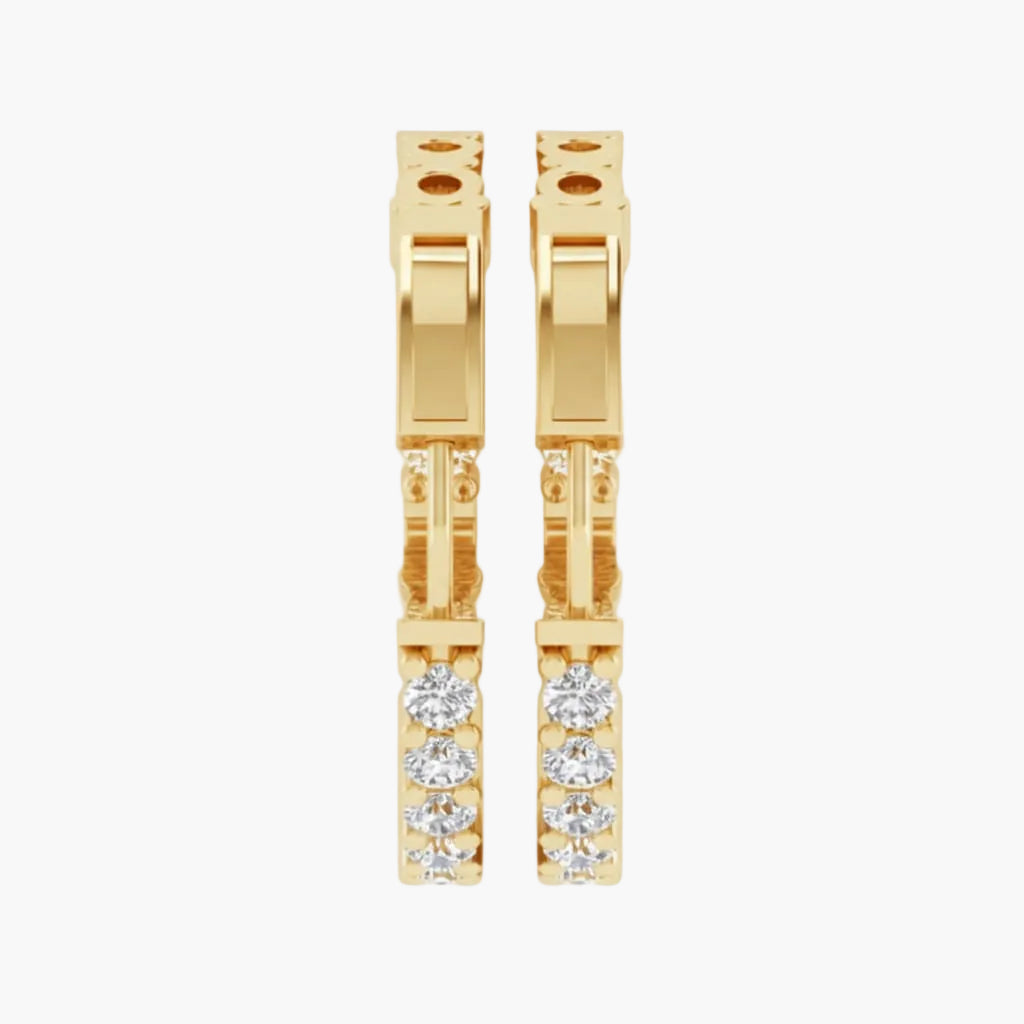 Gold hoop earrings with embedded diamonds on a white background