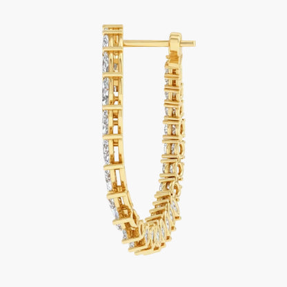 Gold hoop earrings with diamond accents on a white background