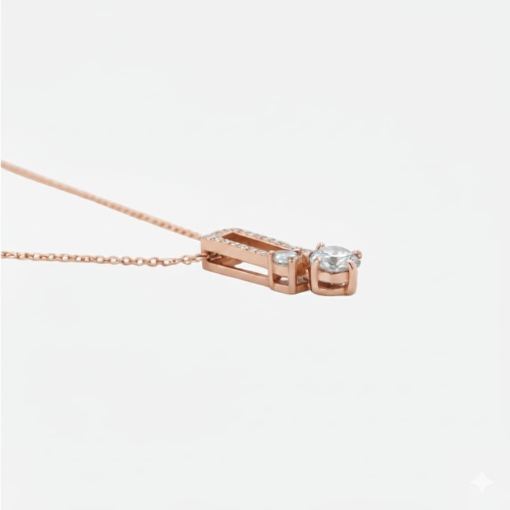 Rose gold necklace with a diamond pendant on a white background