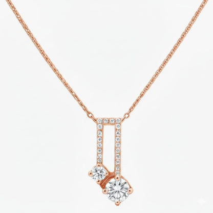Rose gold necklace with a diamond pendant on a white background