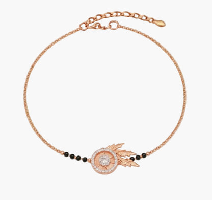 Rose gold bracelet with decorative elements on a white background