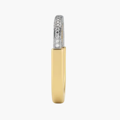 Gold ring with diamond accents on a white background