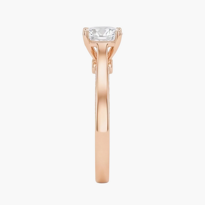 Rose gold ring with a diamond on a white background