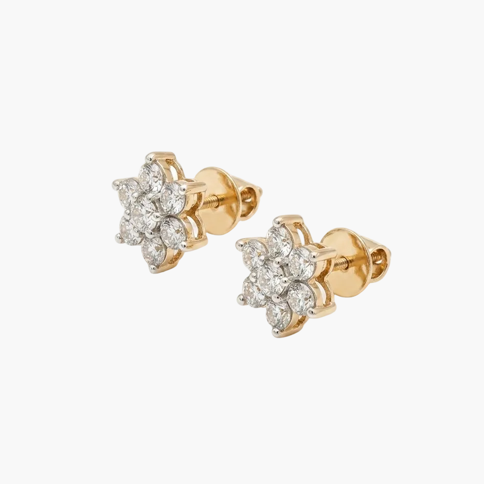Pair of gold earrings with diamond accents on a white background