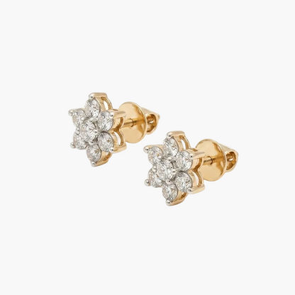Pair of gold earrings with diamond accents on a white background