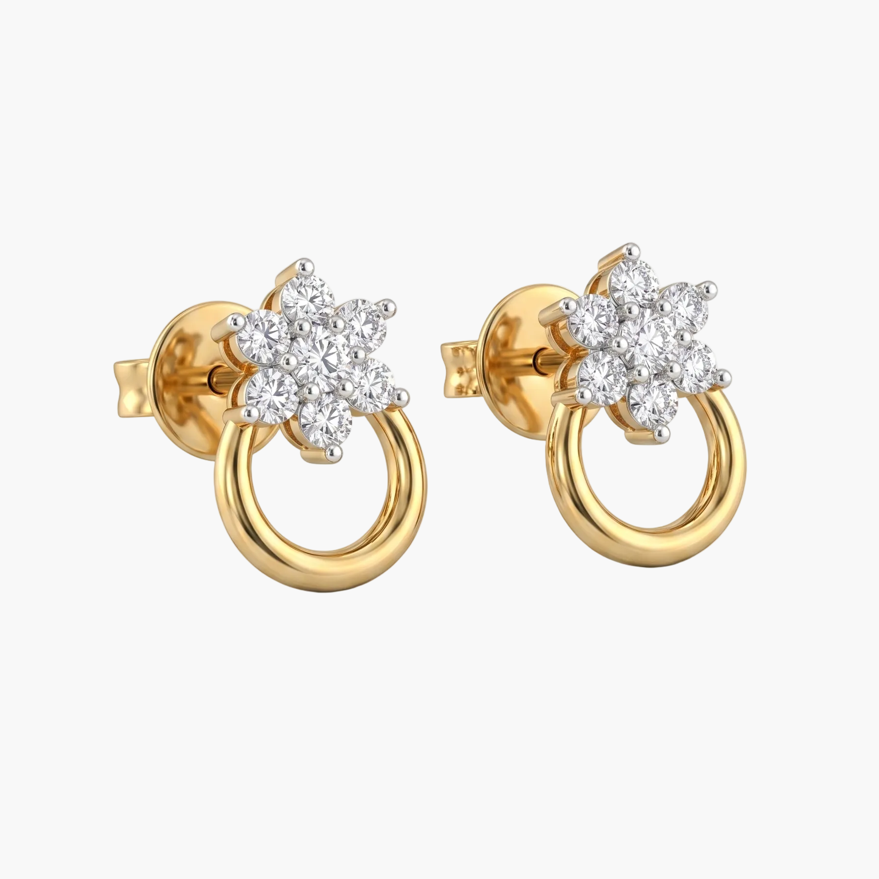 Gold earrings with star-shaped diamond designs on a white background