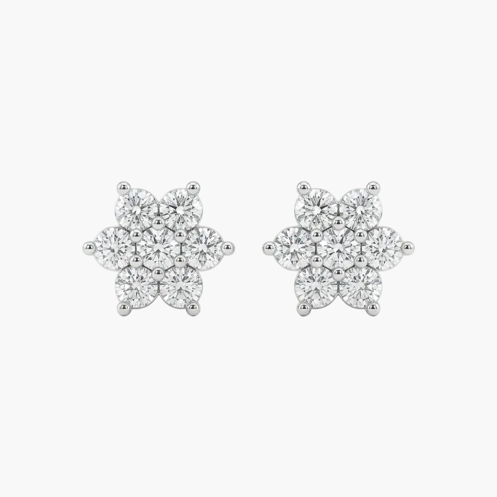 Pair of diamond flower earrings on a white background