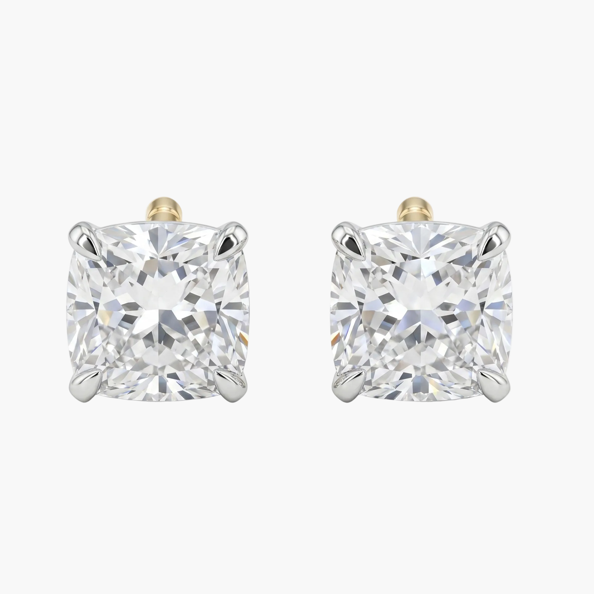 Pair of diamond stud earrings on a white background