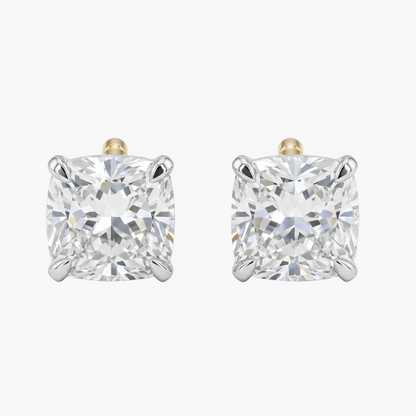 Pair of diamond stud earrings on a white background