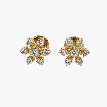 Gold and diamond earrings on a white background
