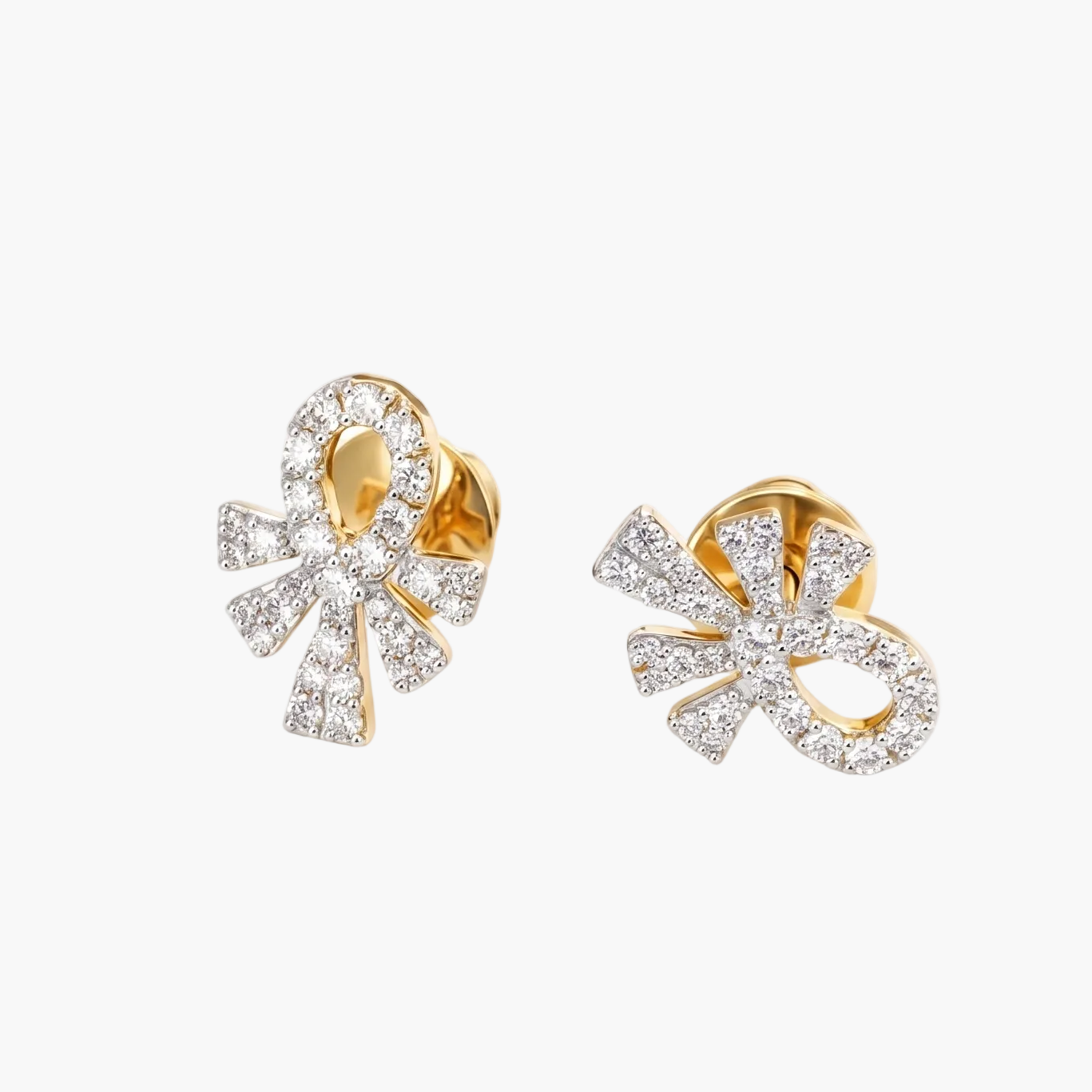 Pair of gold and diamond earrings on a white background