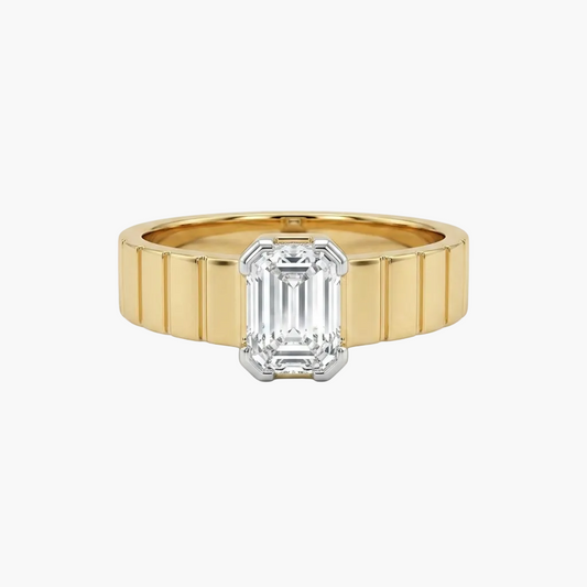 Gold ring with a diamond on a white background