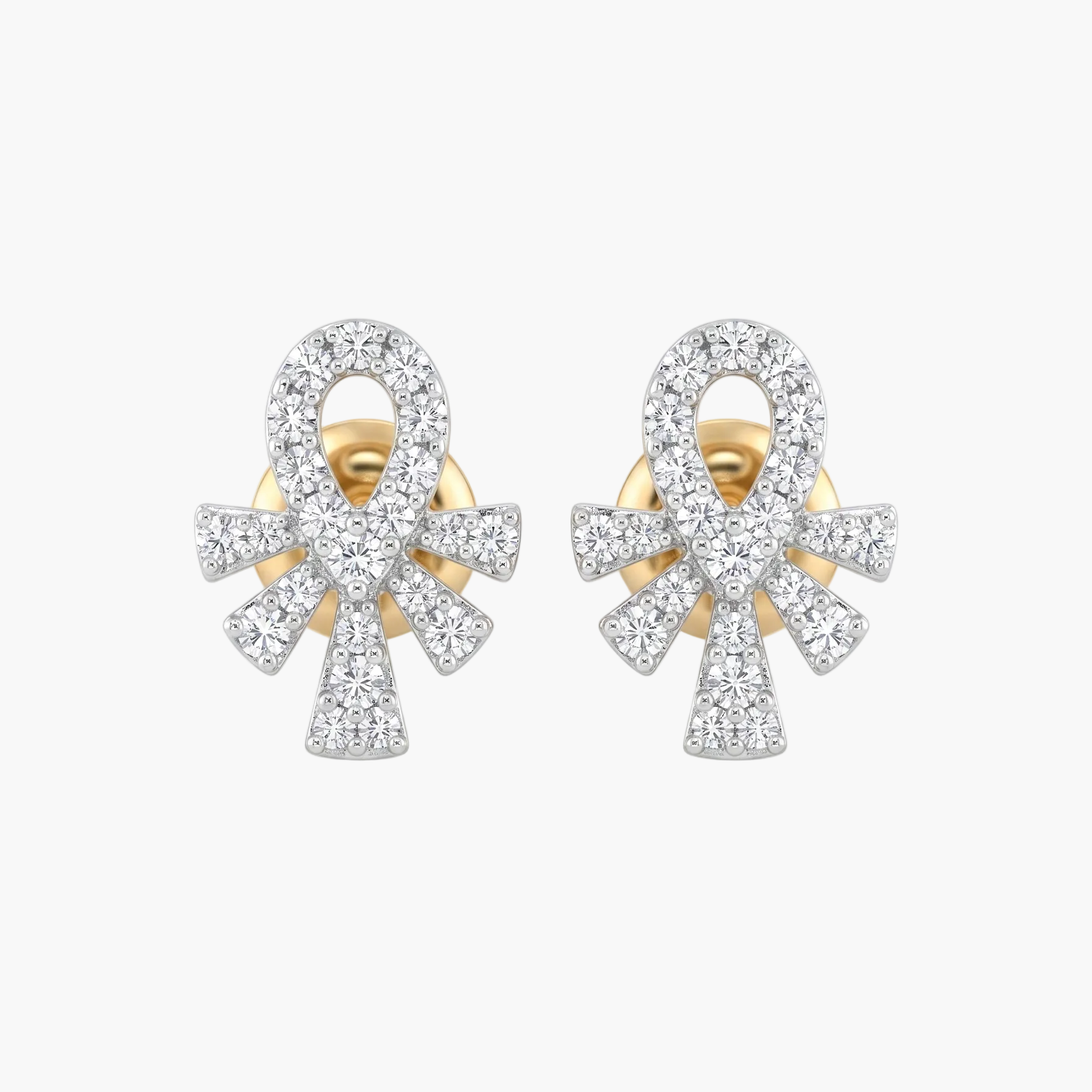Pair of gold and diamond earrings on a white background