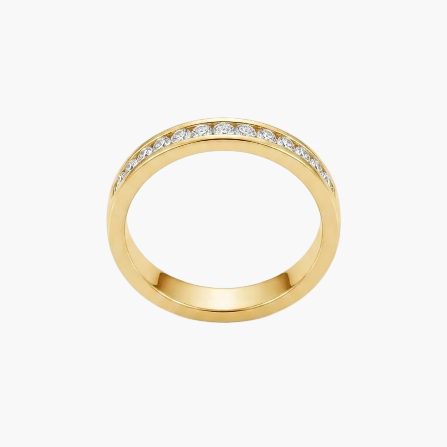 A yellow gold eternity ring featuring a row of small clear pavé-set stones along the top half of the band, shown on a clean white background.