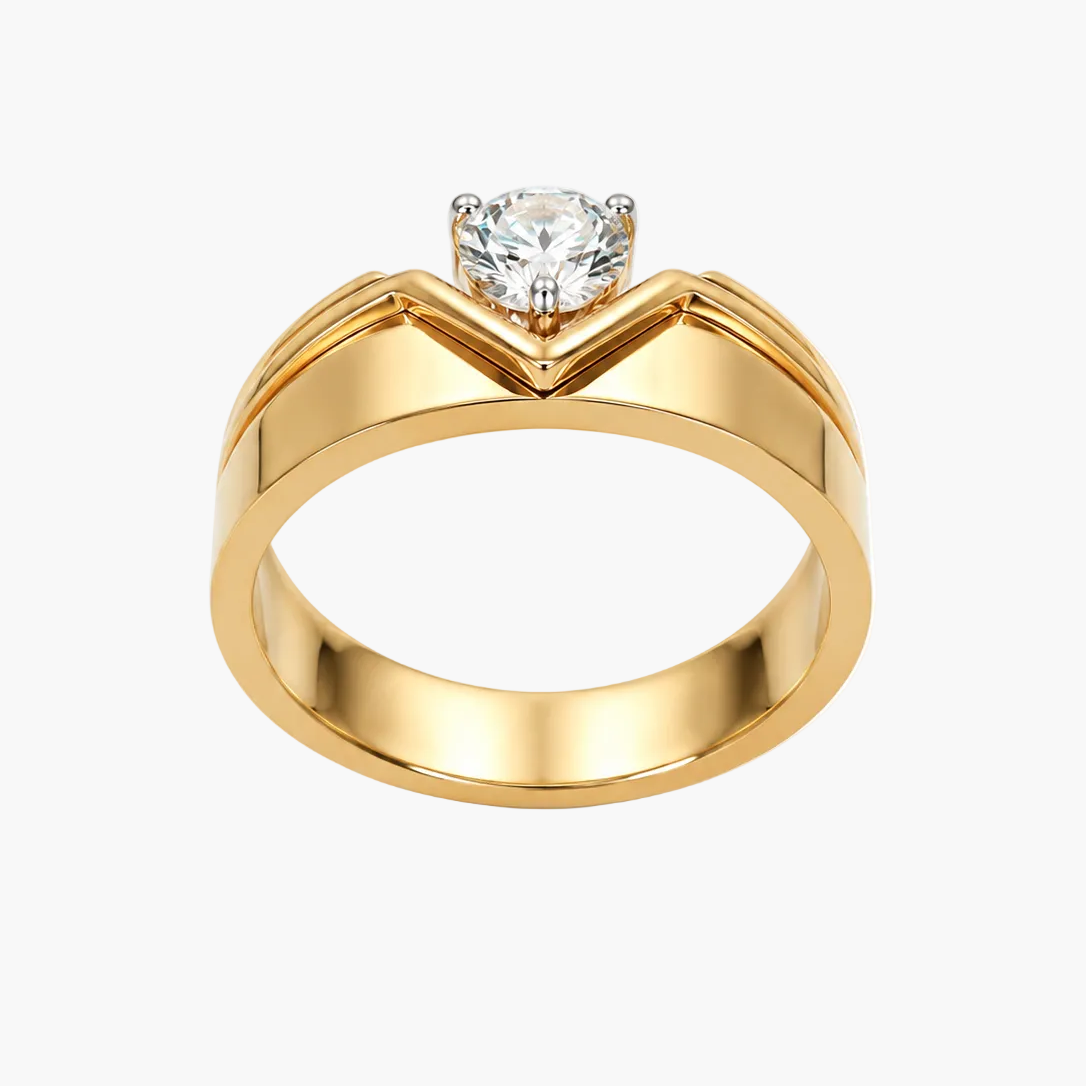 A yellow gold ring with a V-shaped chevron design on the band and a single round-cut clear gemstone in a prong setting, shown on a plain white background.