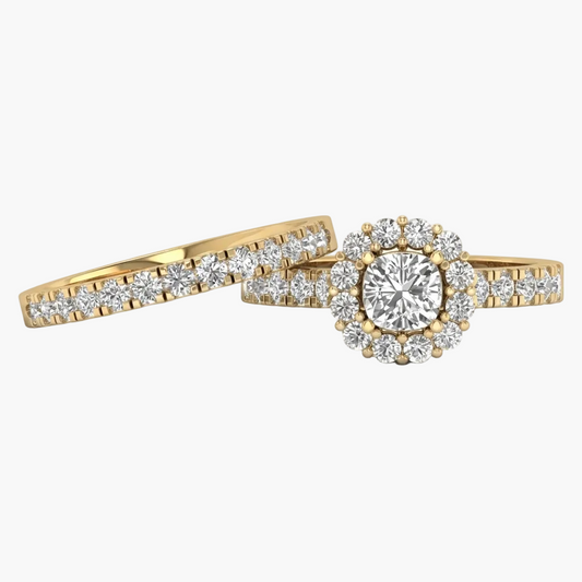 Gold ring with diamond accents on a white background